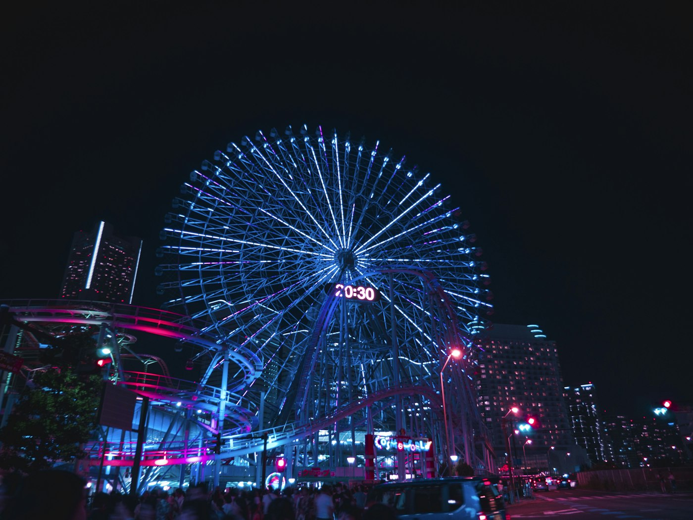 Colourful carnival rides illuminated at night